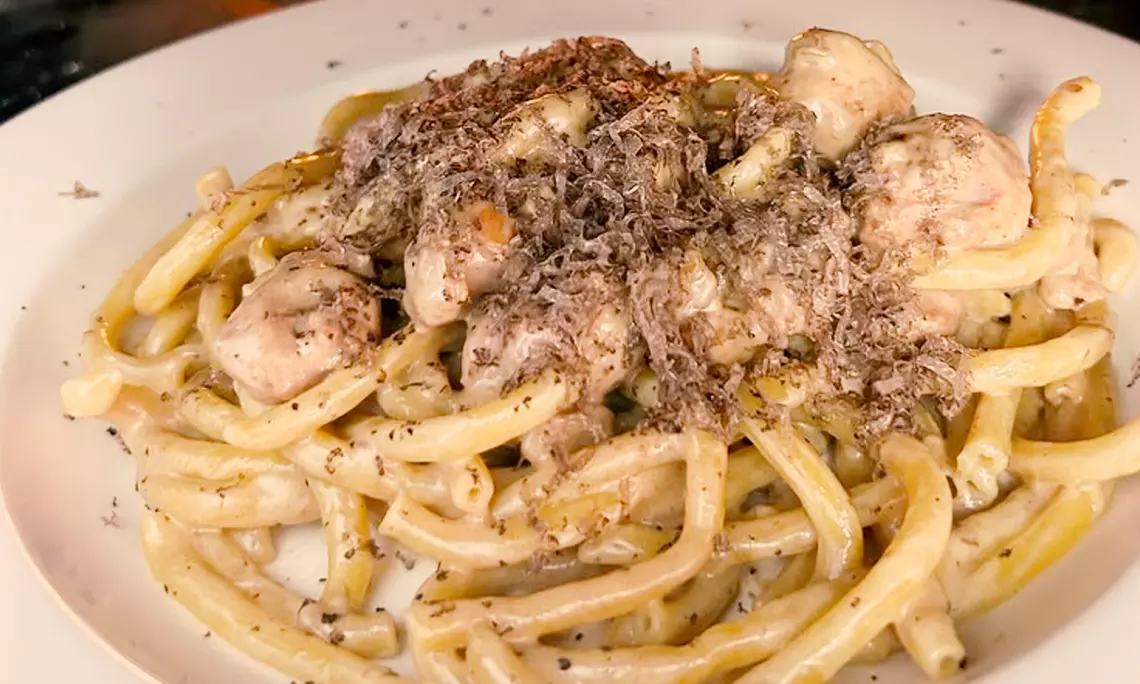 Farina 00 Pasta & Co. signature dishes Olives and Caprese, Creamy Fettuccine Alfredo.